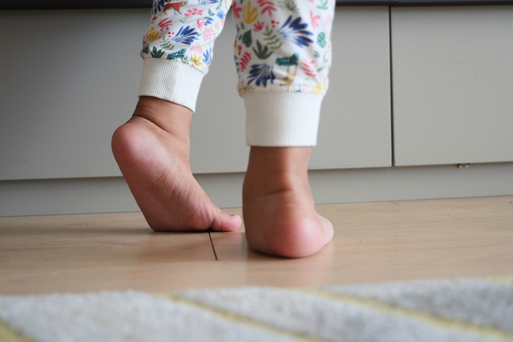 Low Angle View of a Child Walking on Tiptoes